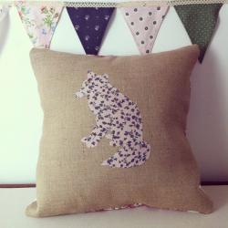 Appliqued, handmade, floral fox cushion on hessian background
