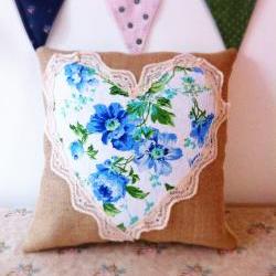 Bright blue floral heart cushion with lace detail